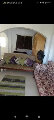 a bedroom with two beds and a rug at Luxor Egypt in Al Baghdādī