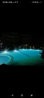 a view of a swimming pool at night at Luxor Egypt in Al Baghdādī