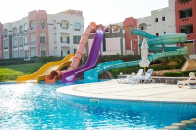a water slide in a pool at a resort at Oysterbay in Marsa Alam
