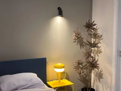 a lamp on a night stand next to a bed at Modern 2BR Villa With Private Pool In Bali In ElGouna in Hurghada