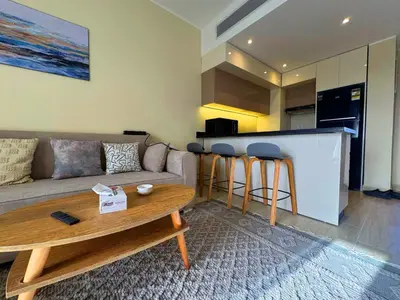 a living room with a couch and a table at Beauty Aldau heights in Hurghada