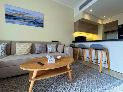 a living room with a couch and a table at Beauty Aldau heights in Hurghada