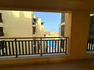 a balcony of a building with a view of the ocean at Beauty Aldau heights in Hurghada