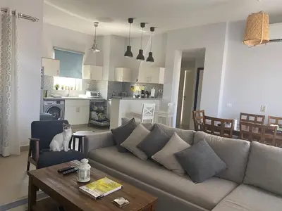 a living room with a couch and a table at El Gouna 2 BR Apartment in Hurghada