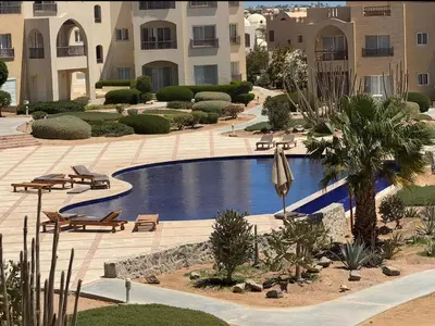 a swimming pool in the middle of a building at El Gouna 2 BR Apartment in Hurghada