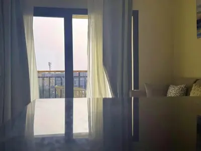a window in a room with a view of a balcony at Aldau Heights one bedroom apartment in Hurghada cr in Hurghada
