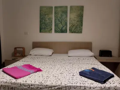 a bed with two towels sitting on top of it at Gcribs B7F7 in El Gouna
