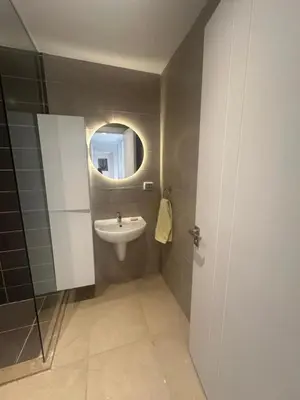 a bathroom with a sink and a mirror at Hotel apartment in G cribs 2BR in El Gouna