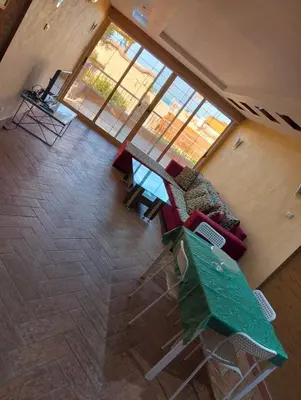 an overhead view of a living room with a couch and chairs at AL Sarfi Apartments in Hurghada