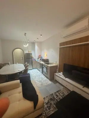 a living room with a couch and a table at Luxury 3BD Makadi Heights phase 2 Orascom in Hurghada