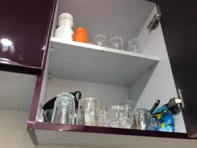 a cabinet filled with glasses in a room at scandic Resort hurghada in Hurghada
