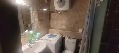 a small bathroom with a toilet and a sink at Beachfront Resort Seaview Haven Modern Near Airport in Hurghada
