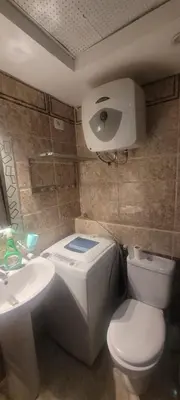 a bathroom with a toilet and a sink at Beachfront Resort Seaview Haven Modern Near Airport in Hurghada
