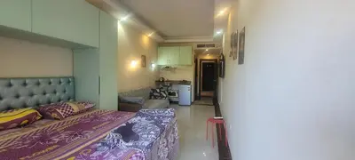 a small room with a bed and a kitchen at Beachfront Resort Seaview Haven Modern Near Airport in Hurghada