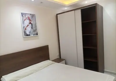 a bedroom with a bed and a closet at -Hurghada HUB Resort-Peaceful Getaway in Hurghada