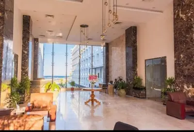 a lobby with couches and a table in a building at pola studio at scandic resort in Hurghada