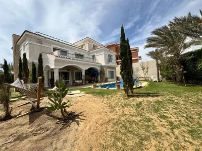 a large house with a yard with a pool at Villa 348 Jamaran - Sahl Hasheesh in Hurghada