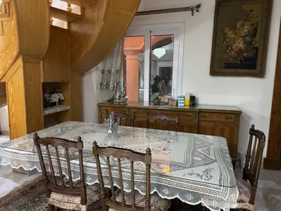 a dining room with a table with chairs and a mirror at Villa 348 Jamaran - Sahl Hasheesh in Hurghada