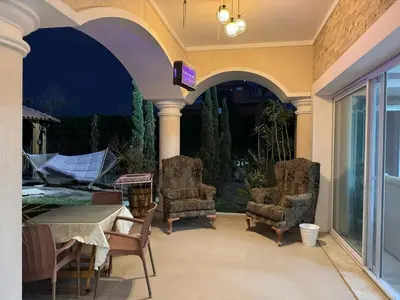 a patio with two chairs and a table and a table and a tableablish at Villa 348 Jamaran - Sahl Hasheesh in Hurghada