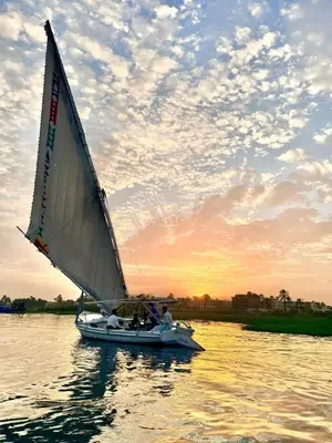 a group of people on a sail boat on the water at valleyofthenileadventures in Luxor