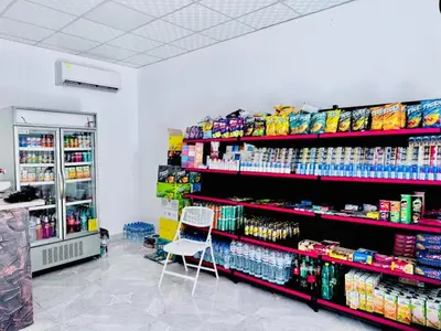 a store aisle with a chair in a store at Al Saraya Sahl Hasheesh by Peaks Studio with Pool View C106 in Hurghada