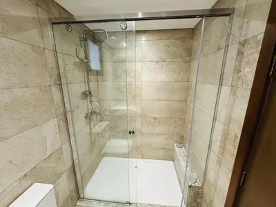 a shower with a glass door in a bathroom at Beautiful Island View in Hurghada