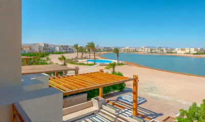 a view of the beach from the balcony of a resort at Luxury Stays in Shedwan El Gouna in Hurghada