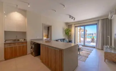 a kitchen with a counter and a sink and a stove at Luxury Stays in Shedwan El Gouna in Hurghada