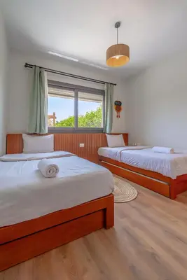 a bedroom with two beds and a window at Luxury Stays in Shedwan El Gouna in Hurghada