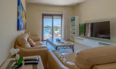 a living room with two couches and a television at Luxury Villas in Joubal El Gouna in Hurghada