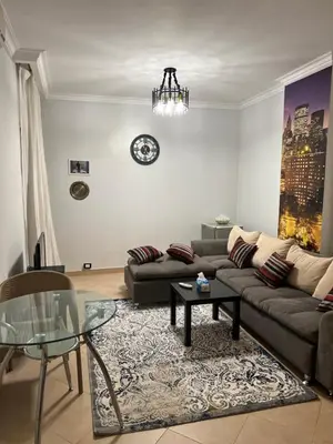 a living room with a couch and a table at ATO luxurious apartments in Hurghada