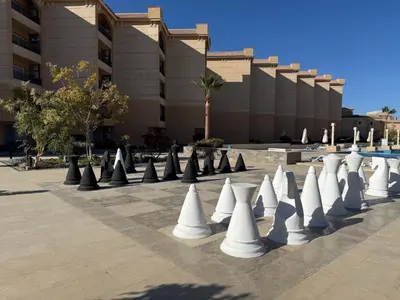 a row of white cones in a courtyard at Luxury Selena Bay Apartment- Private Beach, Kite School 5 Pools in Hurghada