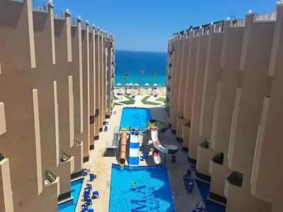 an overhead view of a swimming pool at the beach at Stylish studio with sea view in Hurghada