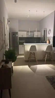 a rendering of a kitchen with white appliances at El Gouna 1 Bedroom Waterside in Hurghada