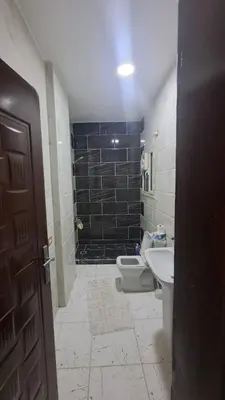 a bathroom with a toilet and a sink at الغردقه الكوثر in Hurghada