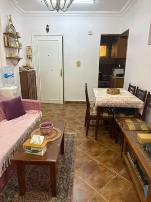 a living room with a couch and a table at Hurghada cozy apartment in Hurghada