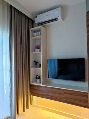 a living room with a large flat screen tv at Perfect studio for holiday in Hurghada