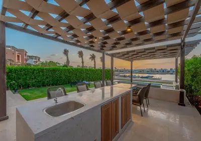 a kitchen with a sink and a view of the ocean at Prime 4BR Villa in Ancient Sands, El Gouna Private Swimming Pool & Lagoon Access in Hurghada