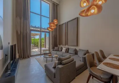 a living room with a couch and a table at Prime 4BR Villa in Ancient Sands, El Gouna Private Swimming Pool & Lagoon Access in Hurghada