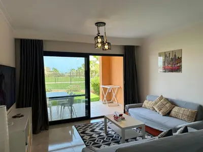 a living room with a couch and a table at The view -Clubhouse in Hurghada