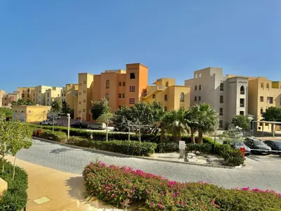 a view of a city with buildings and flowers at One bedroom Mangroovy El Gouna in Hurghada