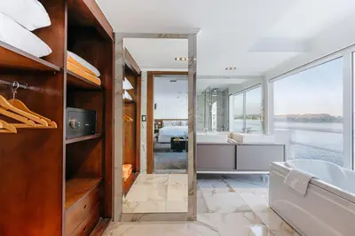 a bathroom with a tub and a sink at Savoy Yacht - Exclusive Nile Cruise from Luxor to Aswan in Luxor