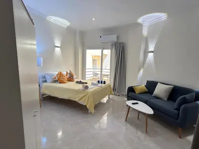 a living room with a bed and a couch at Hurghada Concierge at Fiesta Beach Resort 411 in Hurghada