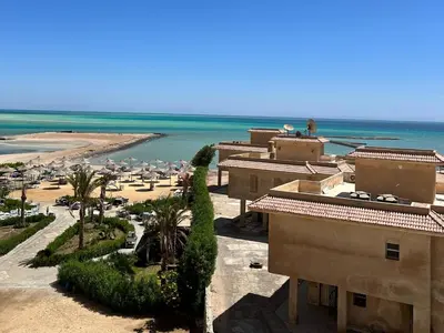 an aerial view of a beach with buildings and the ocean at Hurghada Concierge at Fiesta Beach Resort 411 in Hurghada