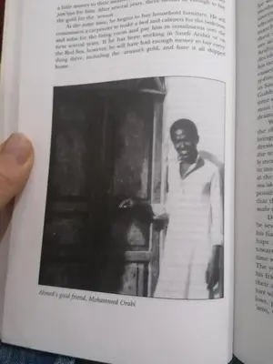 a black and white photo of a man in a book at Abo Orabi Guest House in Aswan
