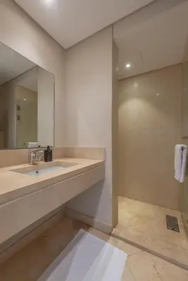 a bathroom with a sink and a mirror at Cozy One Bedroom in Mangroovy in Hurghada