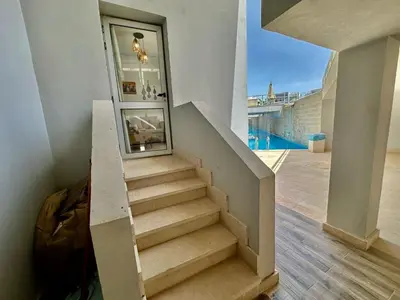 a staircase in a house with a stair case at Cozy 2 bedroom Sholan 1 - Gouna in Hurghada