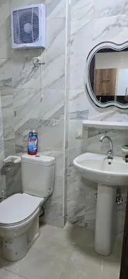 a bathroom with a toilet and a sink at Tiba Golden Resort Hurghada in Hurghada