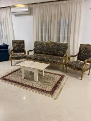 a living room with two couches and a coffee table at فيلا للإيجار فى مجاويش الغردقة in Hurghada