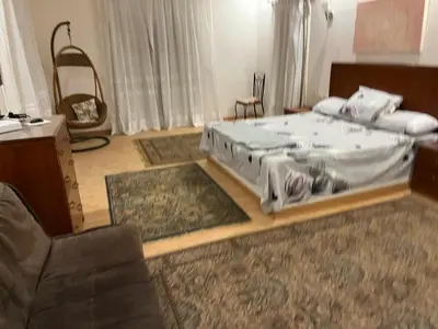 a bedroom with a large bed in a room at فيلا للإيجار فى مجاويش الغردقة in Hurghada